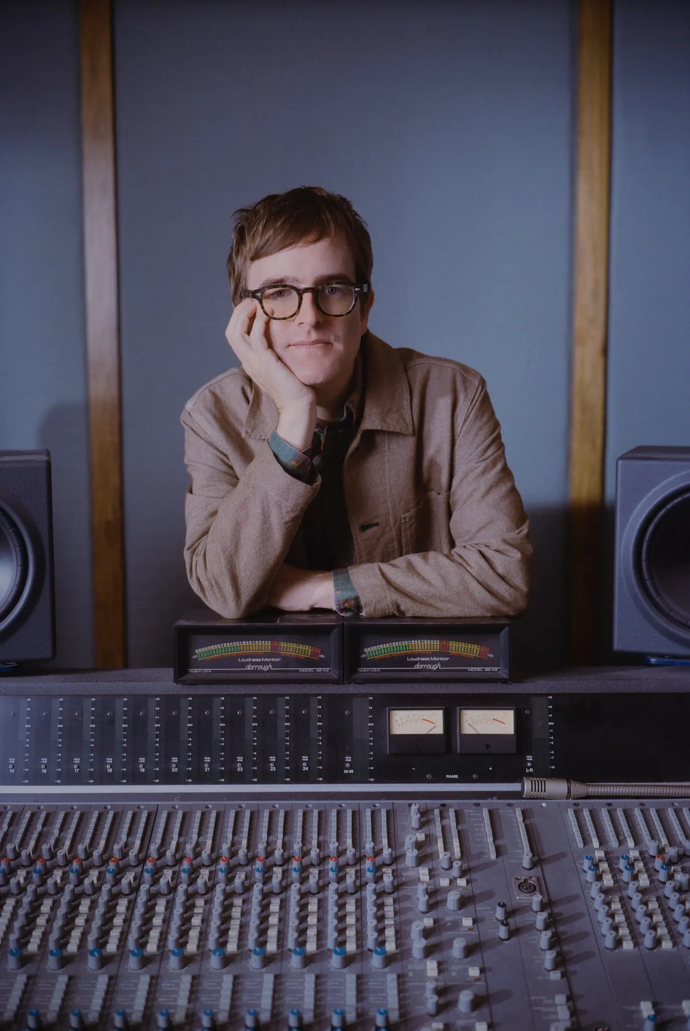 Portrait of Dent May behind the Neotek console